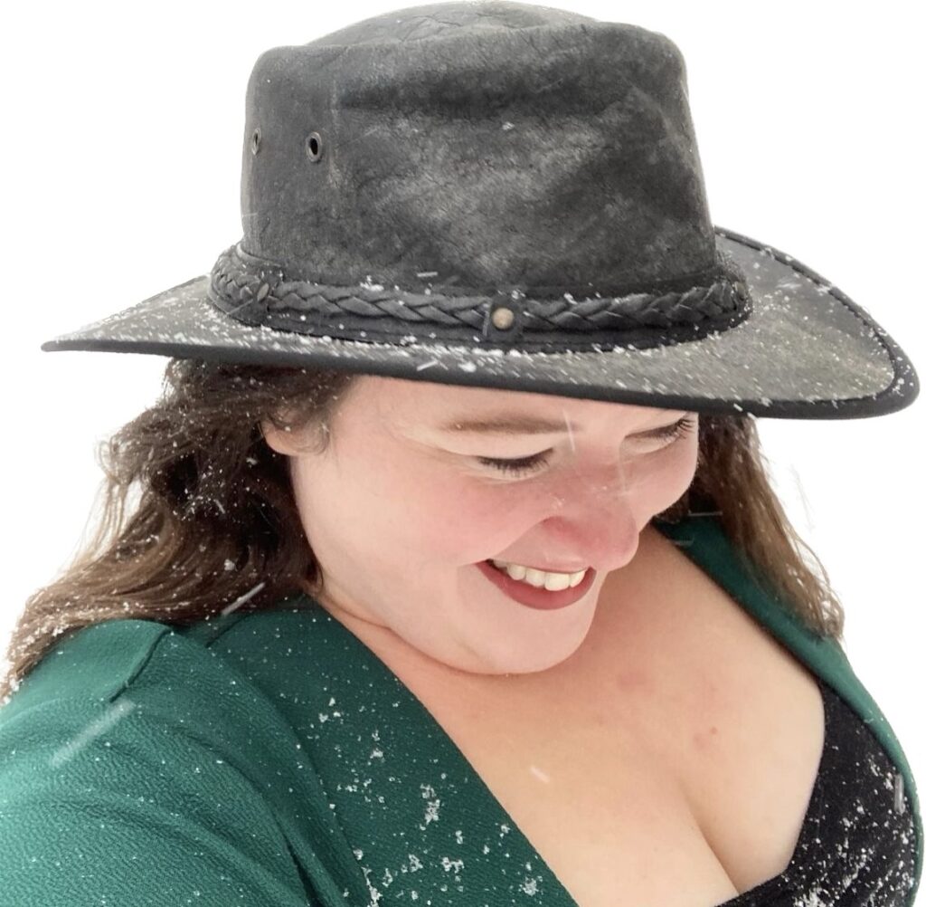 Bobbie JoEle wearing a black cowboy hat in the snow, primary profile picture