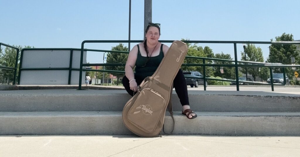 Bobbie JoEle and her GS mini Taylor guitar sits on an empty stage where she performed as part of Joesephella